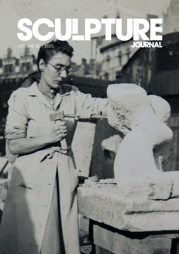 Black-and-white photograph of a woman sculptor working on a stone bust with a hammer and chisel. The journal title ‘Sculpture Journal’ appears at the top, with ‘Volume 32.1, 2023’.
